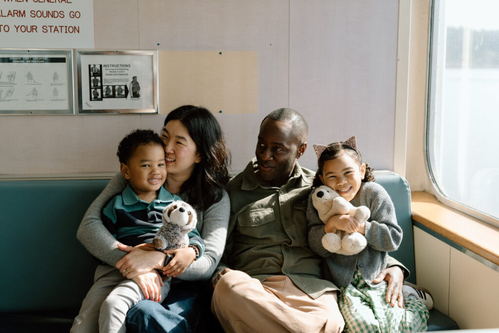 A family snuggles on the Seattle ferry.